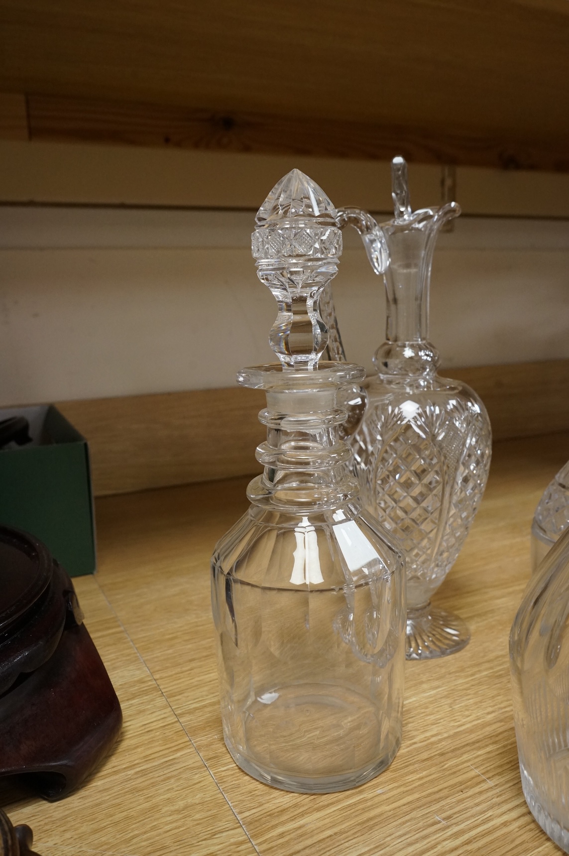 Three early 19th century cut glass decanters and two Victorian jugs, tallest 32cm
